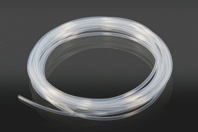 How Does Tubing Material Affect Fluid Transfer Accuracy in Microfluidic Systems?
